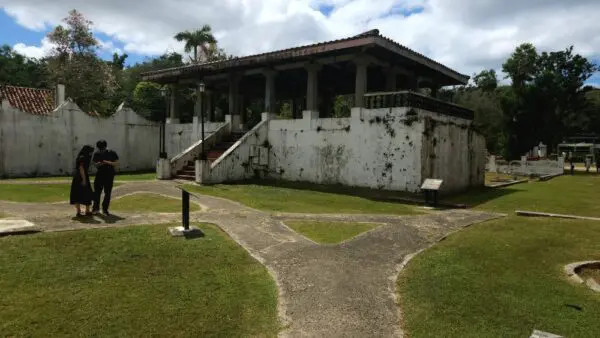 A walkway leading to the entrance of an old building.