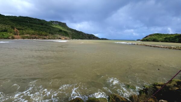 A body of water with waves coming in from the ocean.