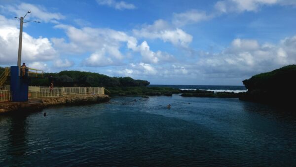 A body of water with a bridge in the middle.